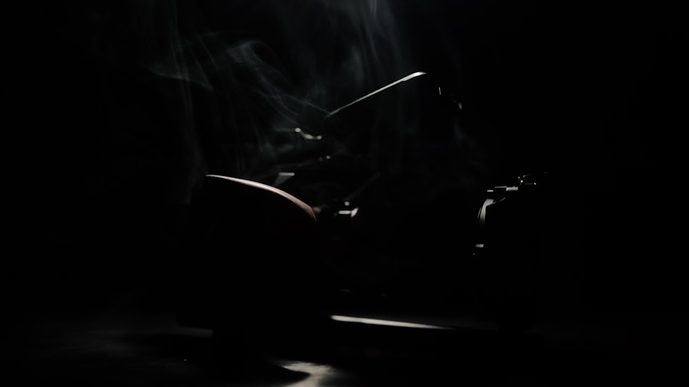 black motorcycle on road during nighttime