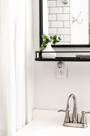 white ceramic sink with faucet