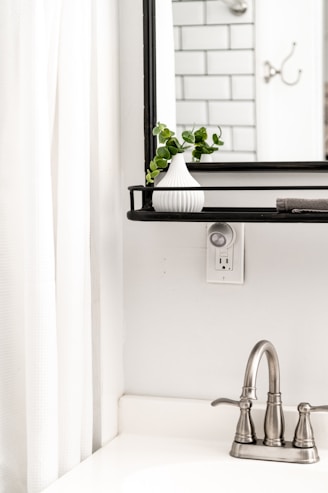white ceramic sink with faucet