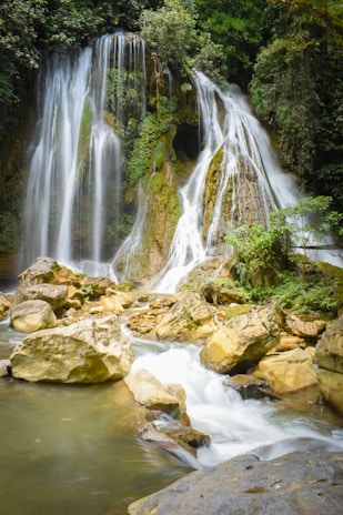 water falls on rocky river
