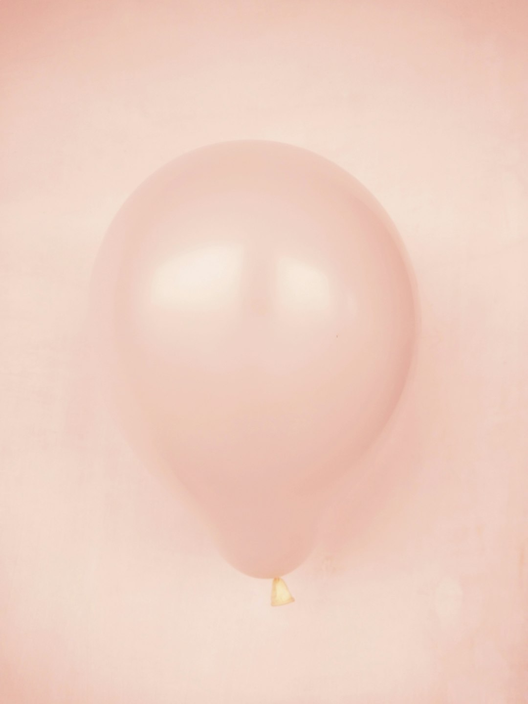 white balloon on white surface