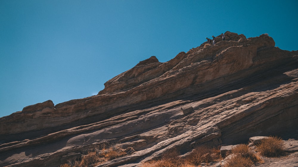 brown rock formation under blue sky during daytime