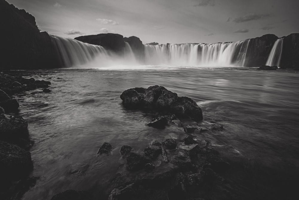 water falls under gray sky