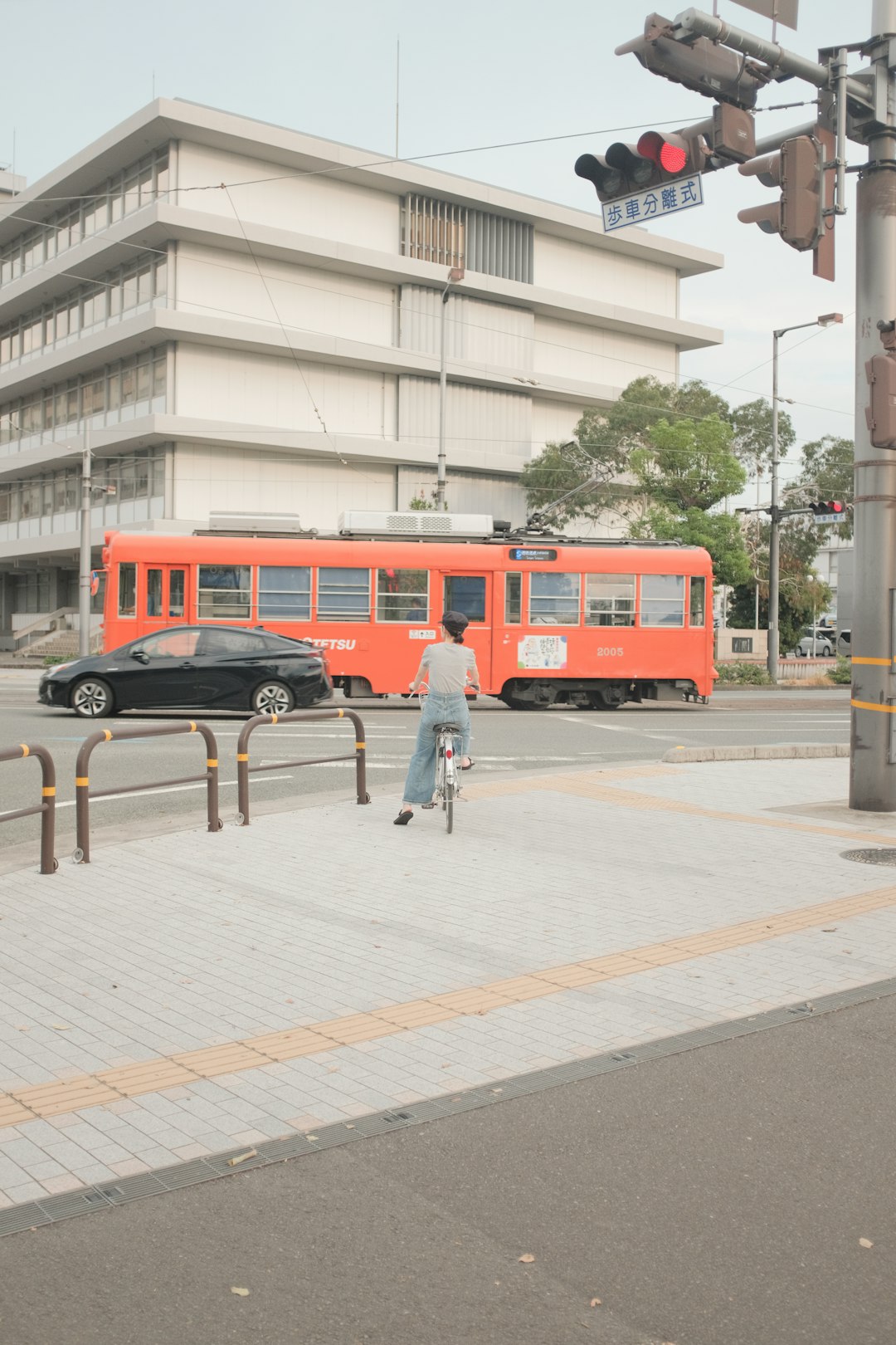 red bus on road during daytime