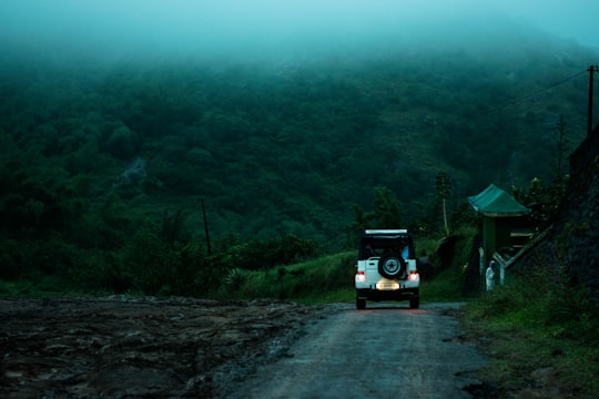 blue suv on road during daytime in Idukki India