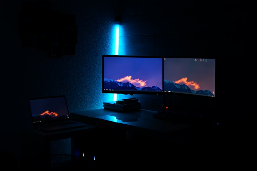 black laptop computer on brown wooden table