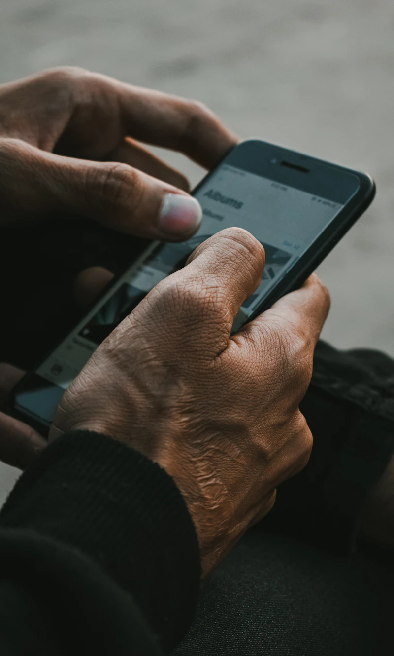 Woman sitting alone with phone waiting for reply