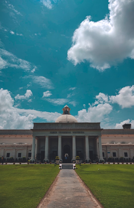 white concrete building under blue sky and white clouds during daytime in Indian Institute of Technology Roorkee India