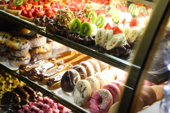 A vibrant display of various food items including snacks and desserts.
