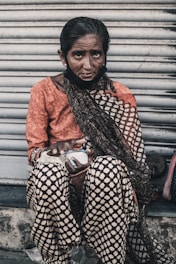 woman in orange long sleeve shirt and black and white hijab