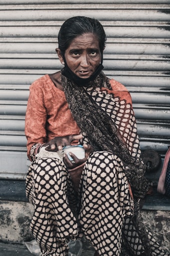 woman in orange long sleeve shirt and black and white hijab