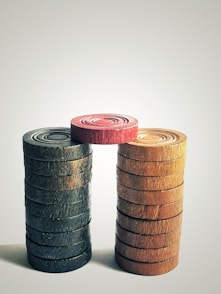 brown wooden barrels on white surface