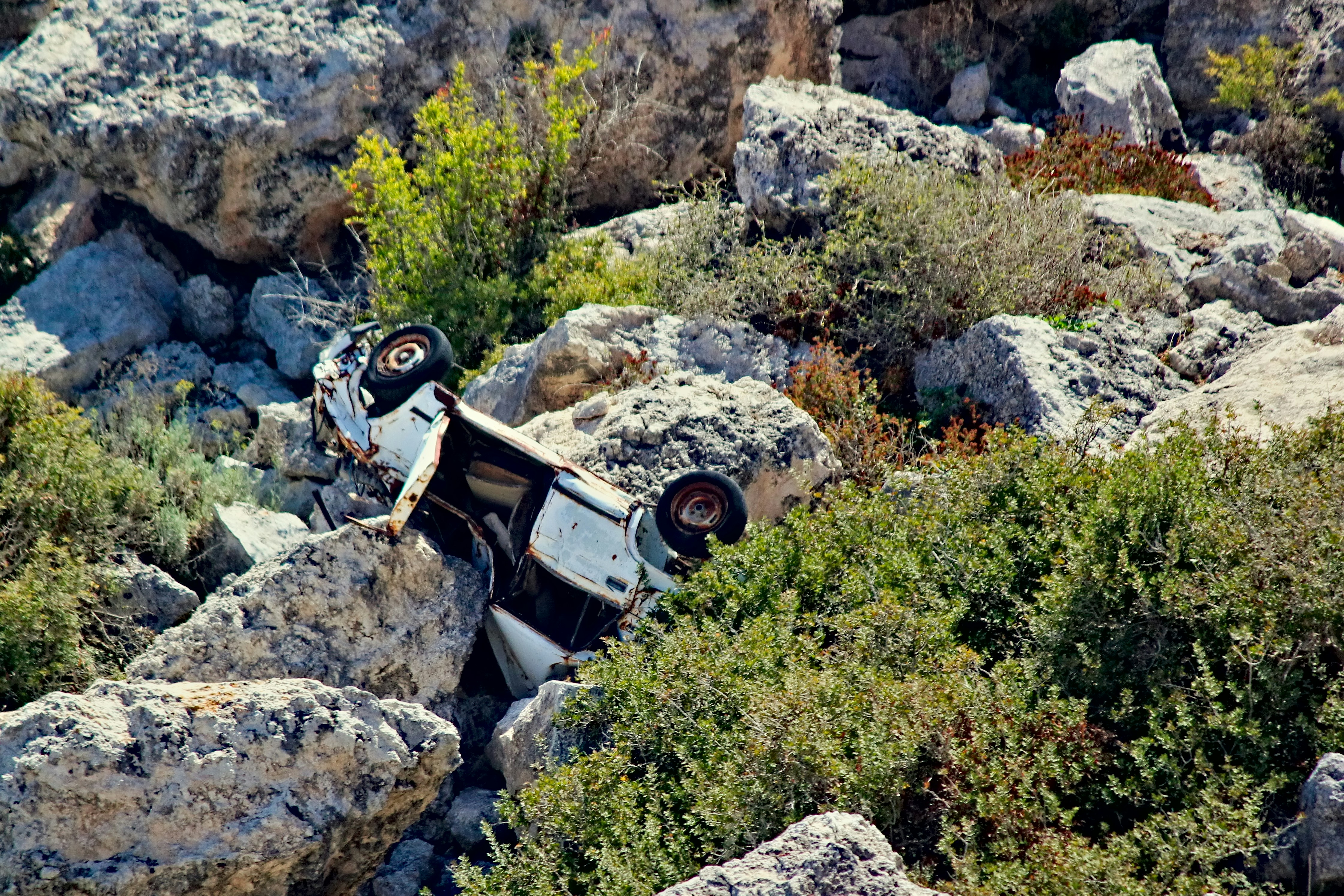 black and white car on rocky mountain during daytime