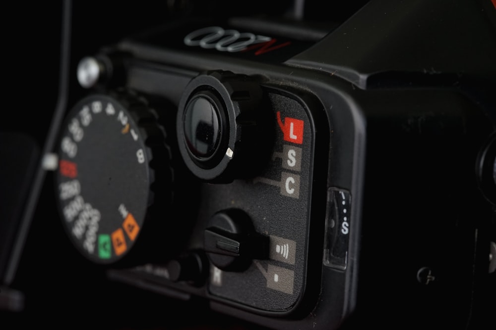 a close up of a camera with a black background