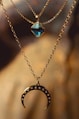 silver chain necklace with blue gemstone pendant