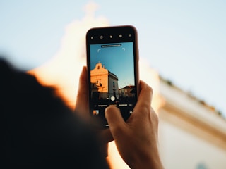 person holding black android smartphone
