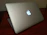 Close-up of a sleek laptop with a new SSD installed, glowing softly on a minimalist desk.