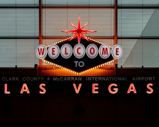 the welcome sign to las vegas is lit up