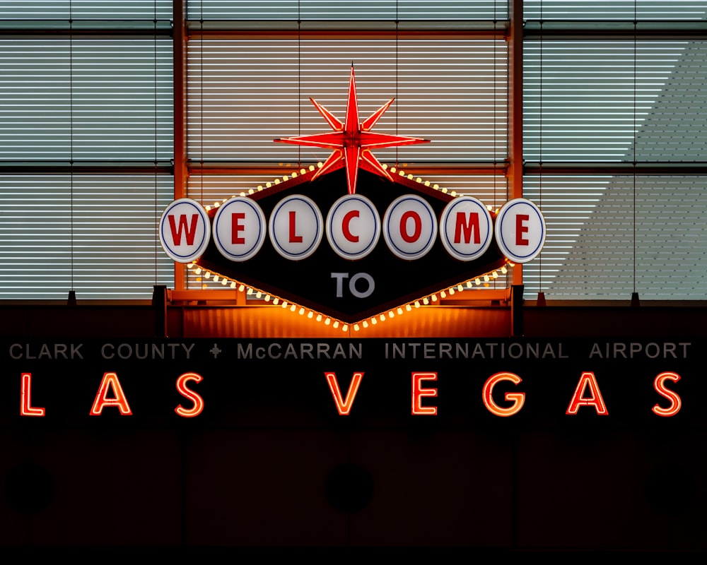 the welcome sign to las vegas is lit up