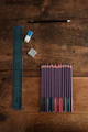 blue and white pencils on brown wooden table