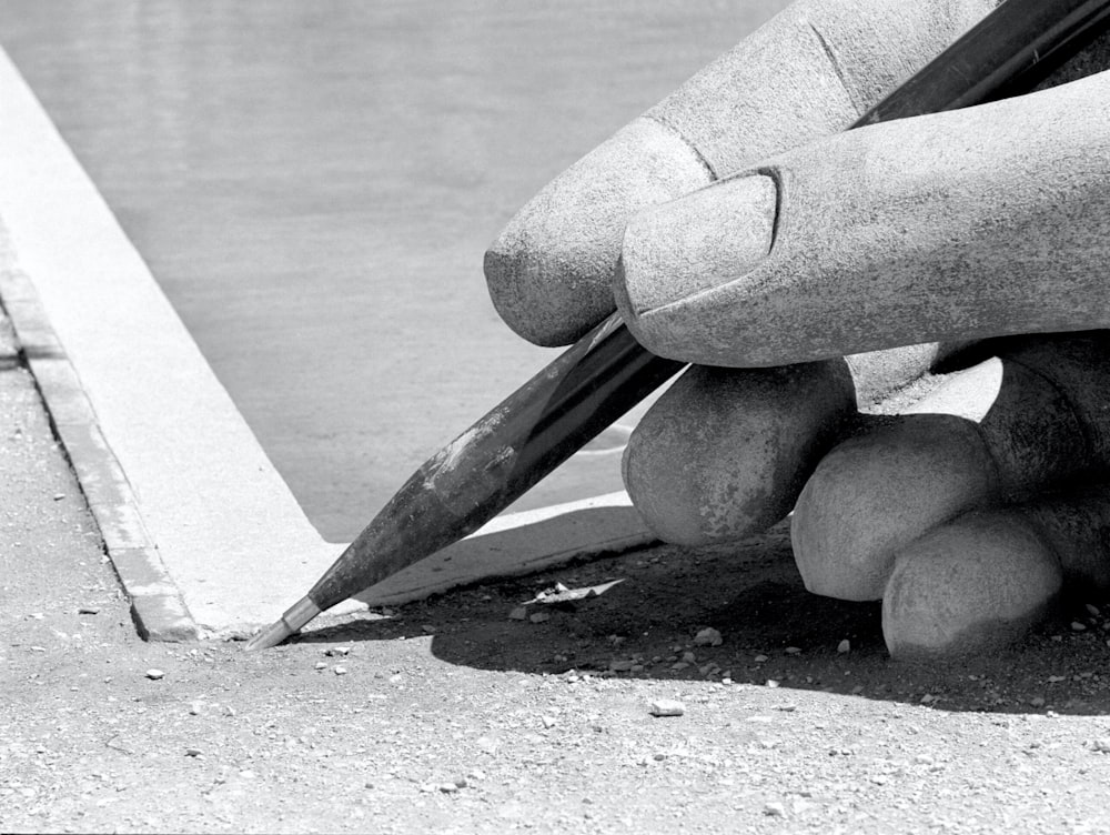 gray scale photo of person wearing gloves