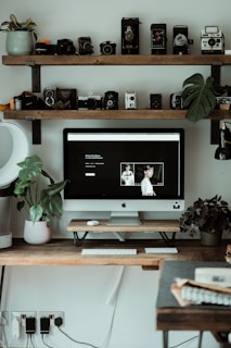 black flat screen tv on brown wooden tv rack