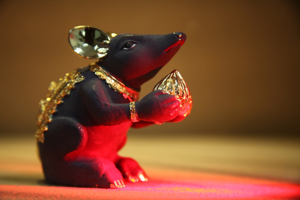 red and gold animal figurine