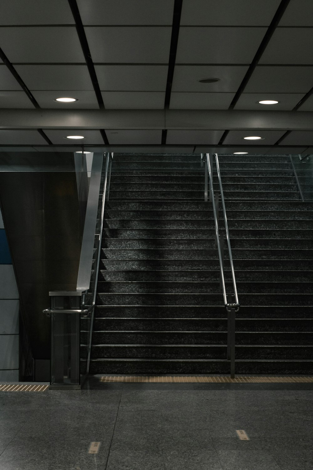 black and silver escalator in a room