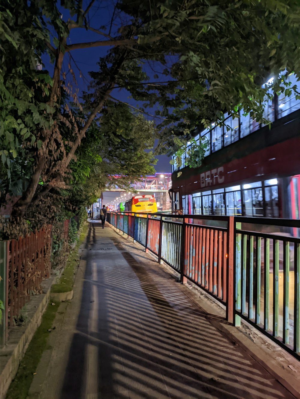 brown wooden bridge with yellow metal railings