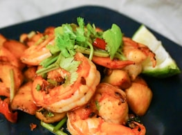 cooked shrimps on blue ceramic plate