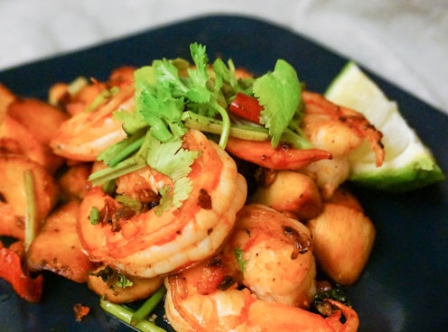 cooked shrimps on blue ceramic plate