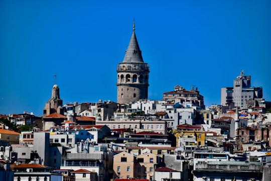 white and brown concrete building under blue sky during daytime in Golden Horn Turkey
