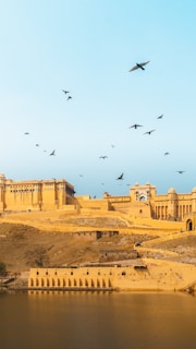 Historic Sindhudurg Fort standing strong against a clear blue sky.