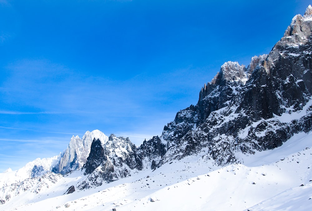 snow covered mountain under blue sky during daytime