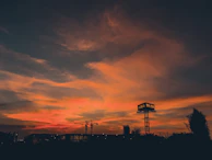 Sunset view of a commercial complex with lights turning on, showcasing the finished project’s elegance.