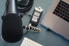 A serene workspace with a microphone and notes ready for voice recording