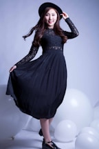 woman in black long sleeve dress
