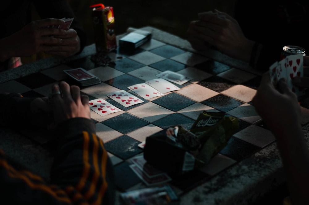 person playing chess on chess board