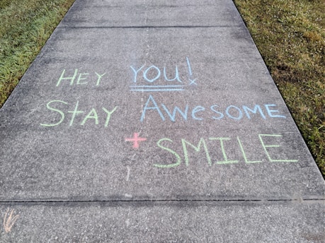 a sidewalk with a message written on it