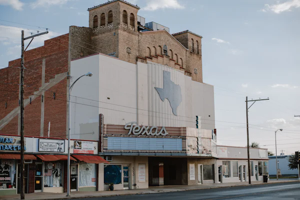 Building near farmland representing peach farming Somerset Texas