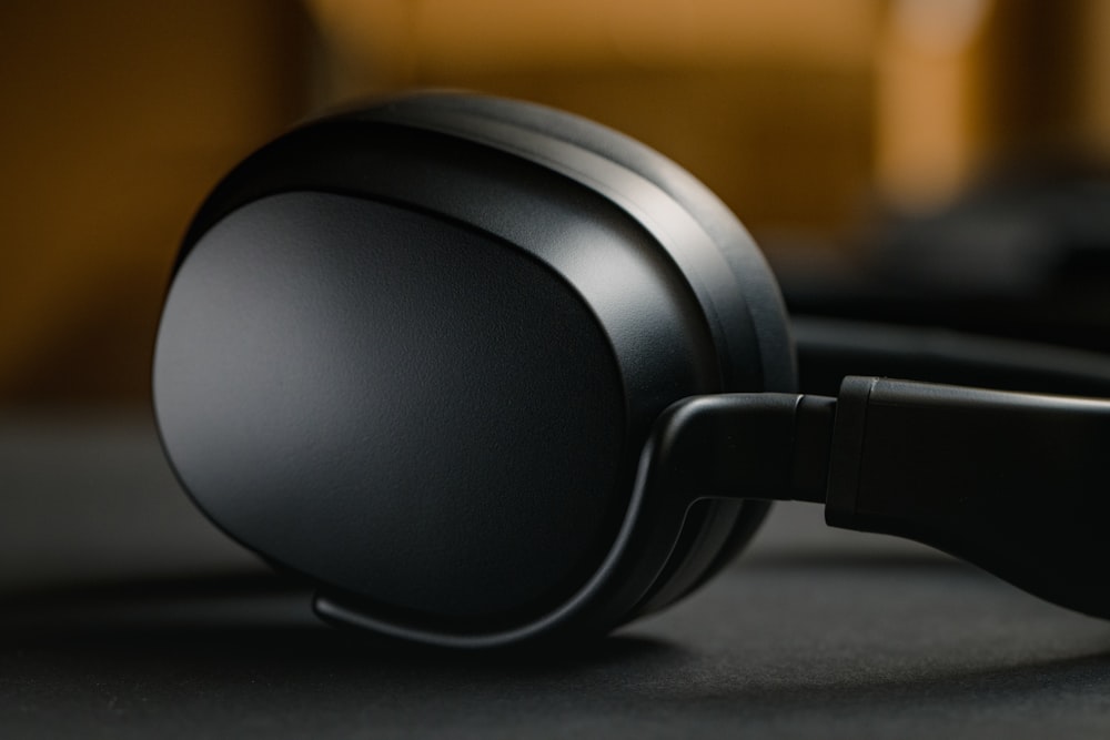 black headphones on black table