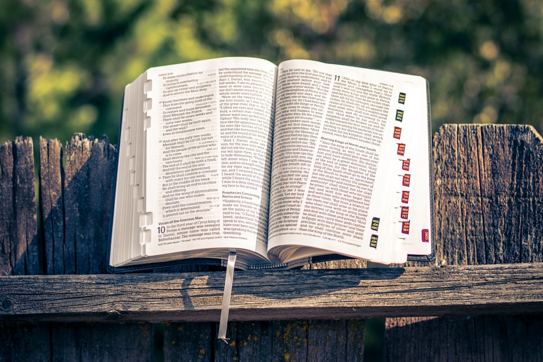 white book page on brown wooden table