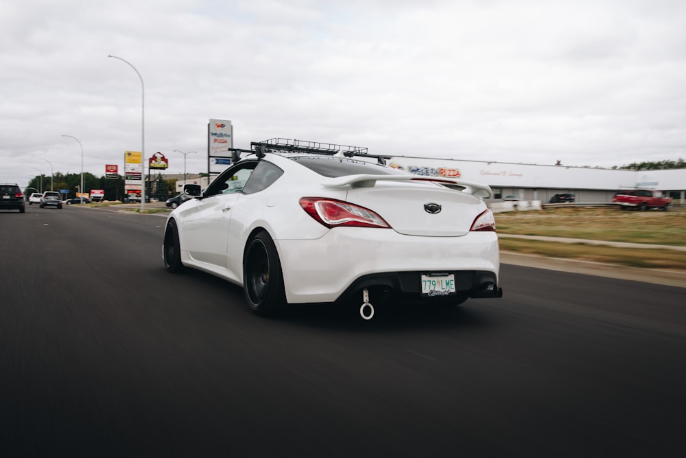 white porsche 911 on road during daytime