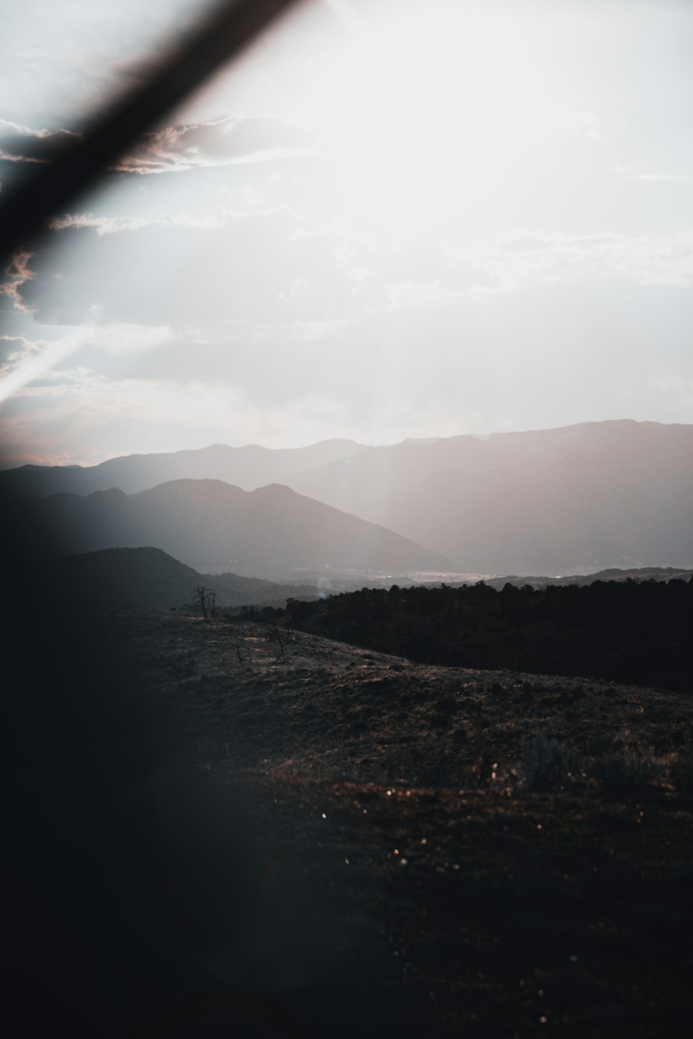 silhouette of mountains under white clouds during daytime