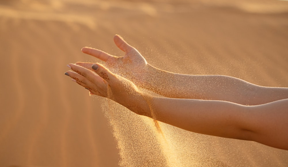 persons feet on brown sand