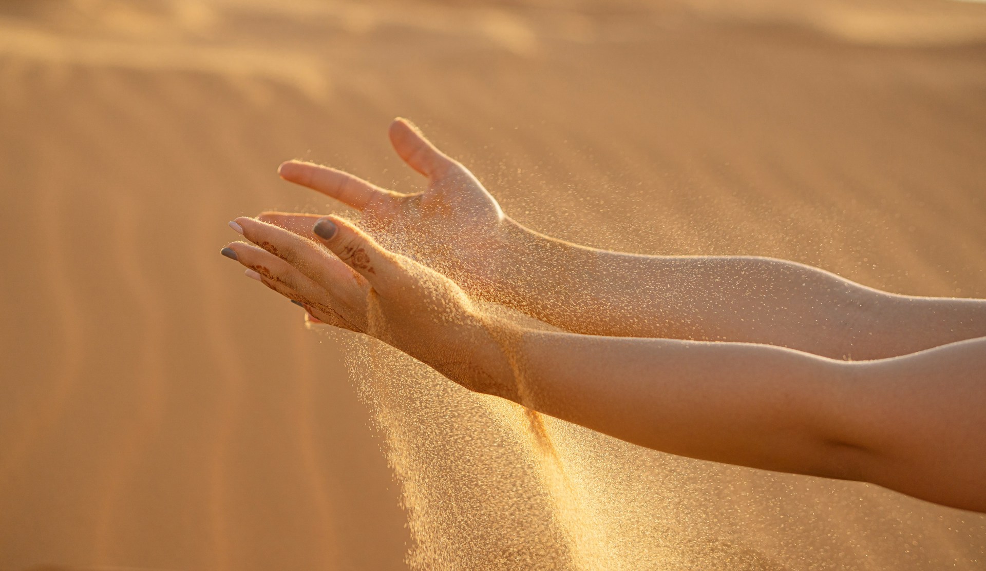 persons feet on brown sand