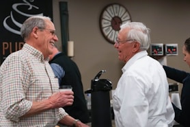 a group of people standing around each other