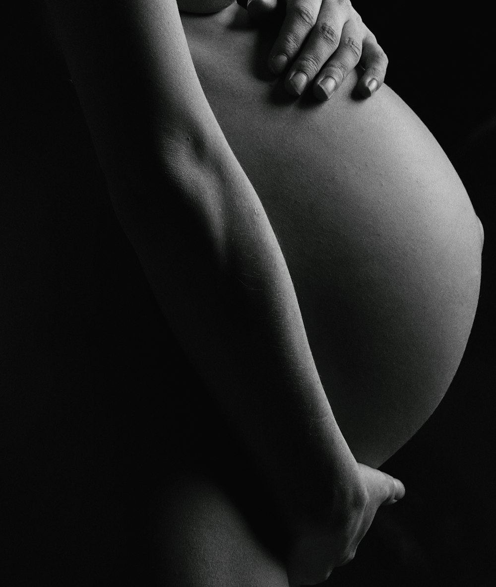 grayscale photo of womans legs