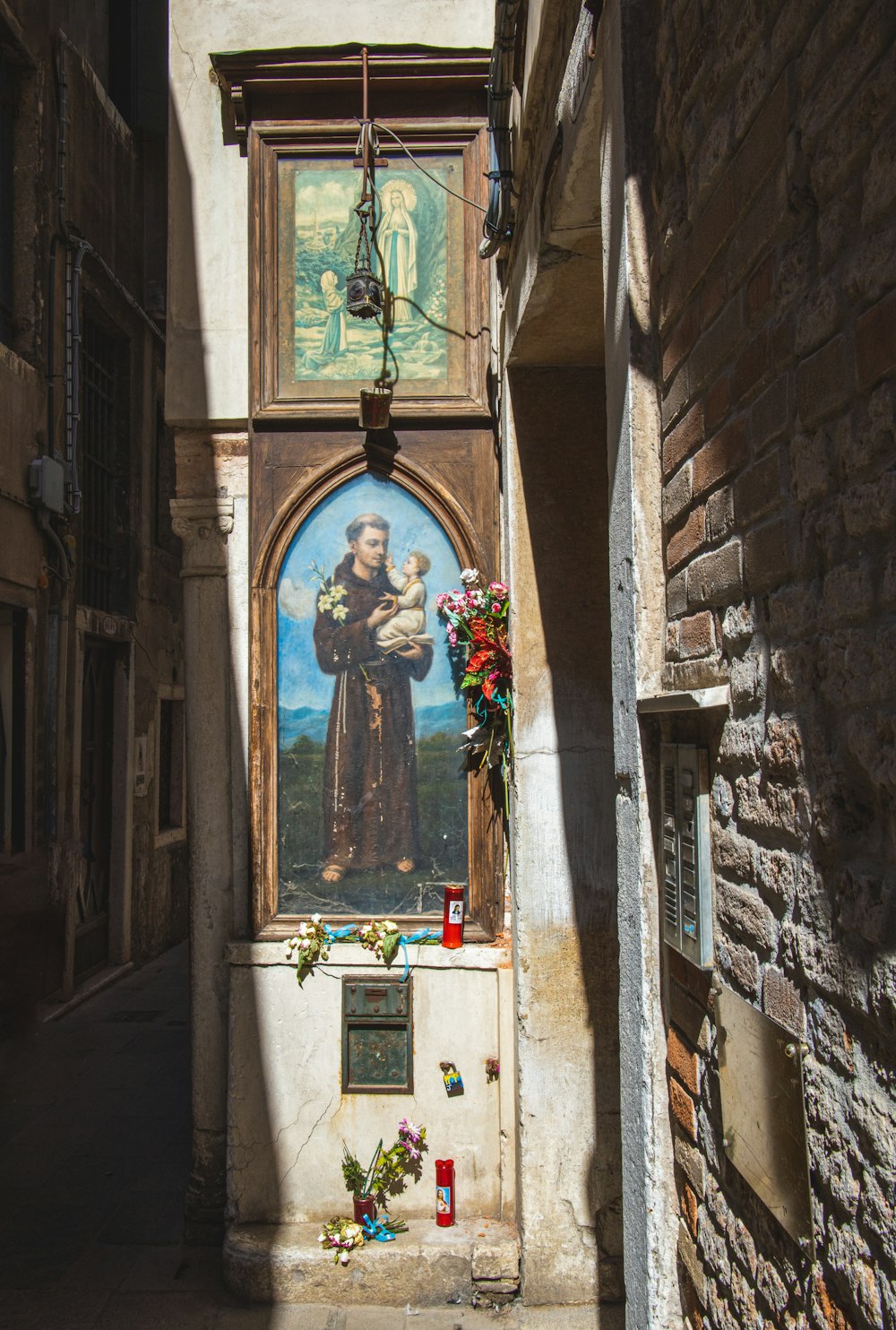 jesus christ on cross on brown concrete building