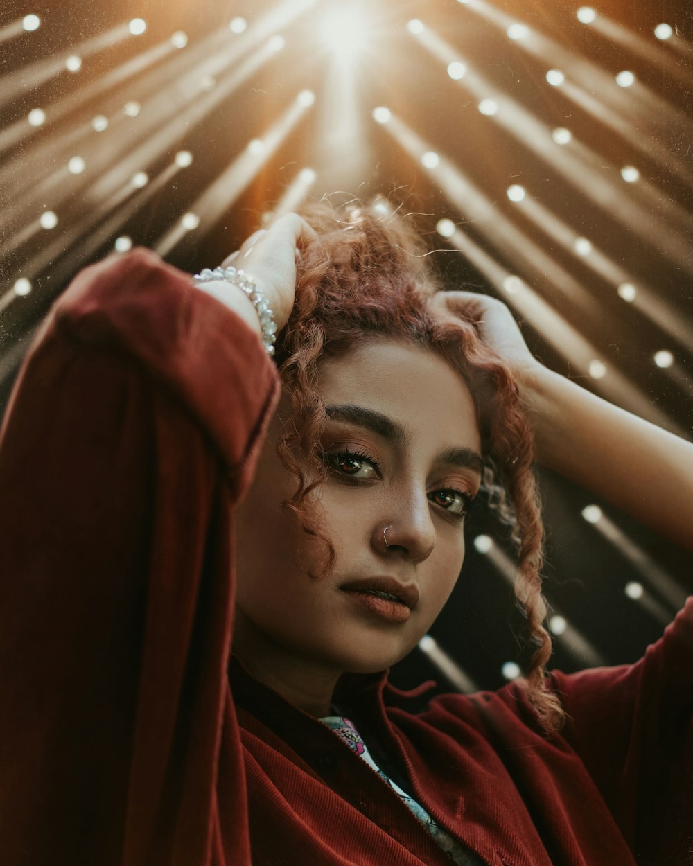 woman in red scarf and black shirt